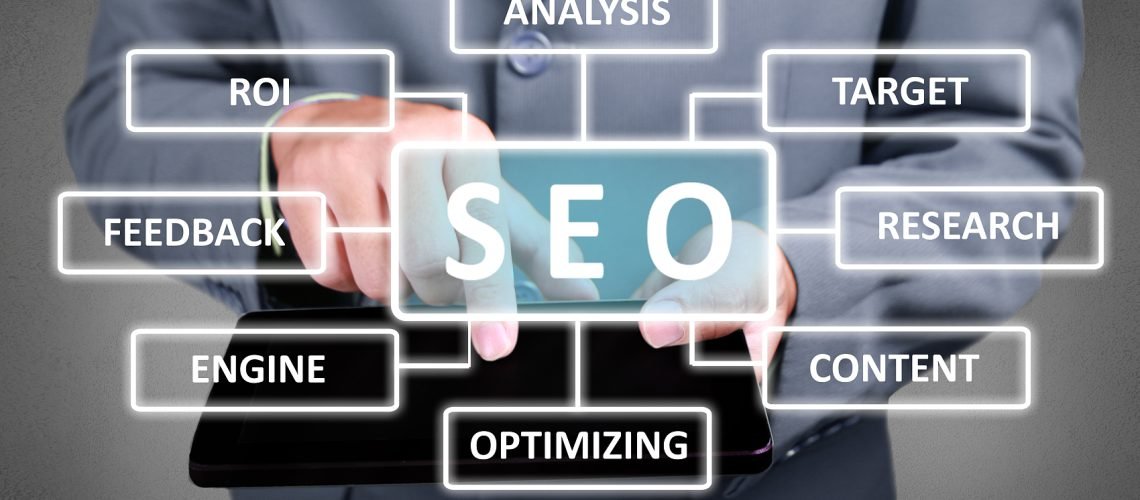 Internet business concept. Businessman click SEO button on his tablet. Search Engine Optimization strategy scheme diagram. Text typography design